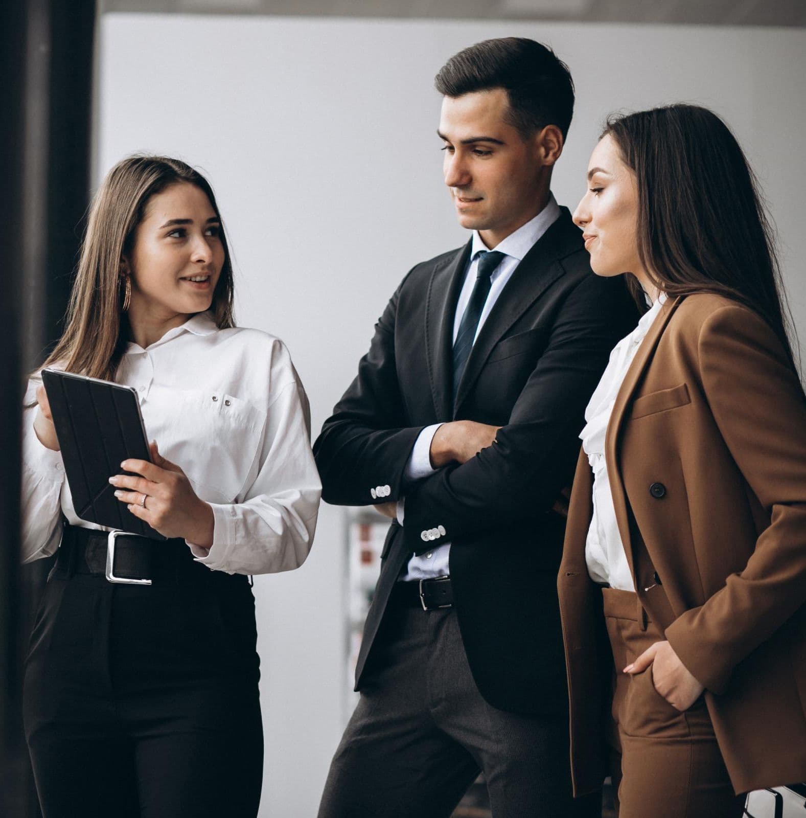 Business people discussing something on a tablet